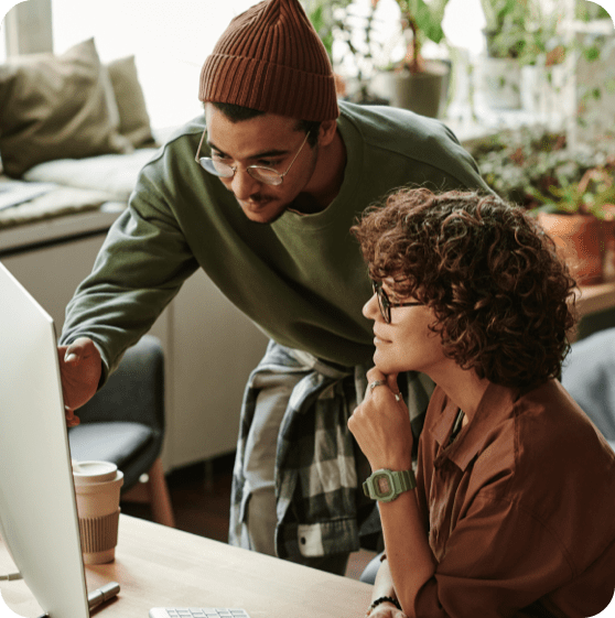 guy and girl at computer monitor